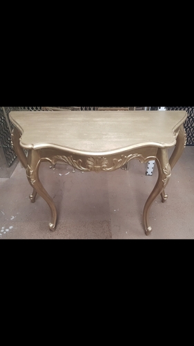 Small gold carved console
